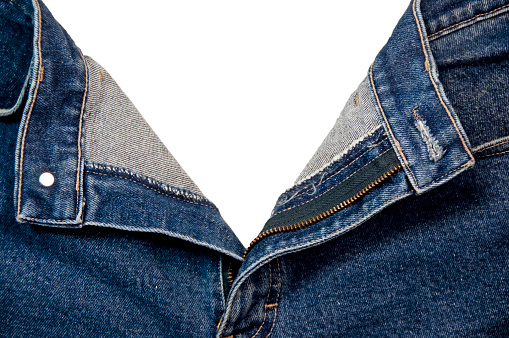 A pair of jeans with the fly opened and clipping path.