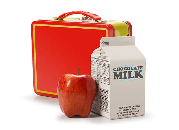 "A student's lunch, consisting of a lunch box, apple, and chocolate milk carton. Isolated on white with clipping path.From same series:"