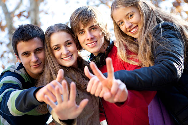 istock Group of cheerful friends gesturing with hands 182416804