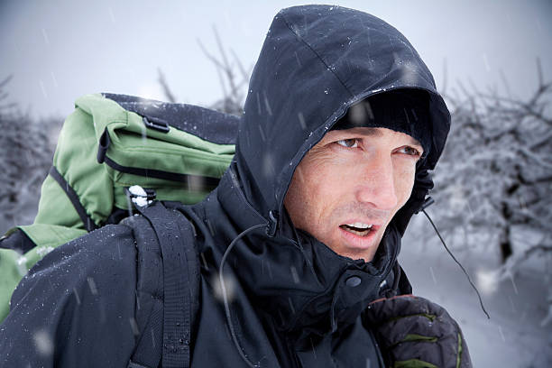 Adventure Seeking Hiker in Heavy Snow stock photo