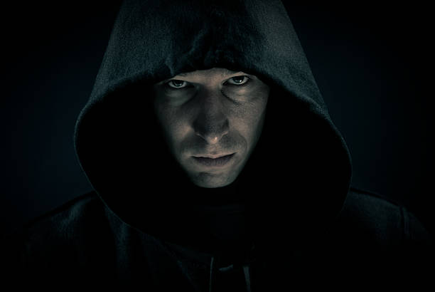 istock Mysterious man in the dark shadow 182417684