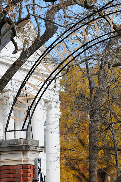 istock University sign with tree and building background 182418337