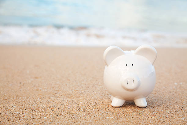 istock Piggy Bank On the Beach 182418577