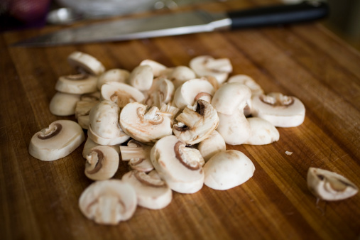 Sliced mushrooms on a cutting board