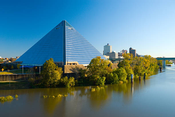 Pyramid Arena and the Memphis, TN city skyline "The Pyramid Arena landmark building in Memphis, with the Memphis Downtown skyline in the background and Wolf River in the foreground." memphis tennessee stock pictures, royalty-free photos & images