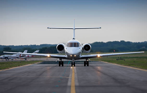 istock Plane departing on the runway at dusk 182419455