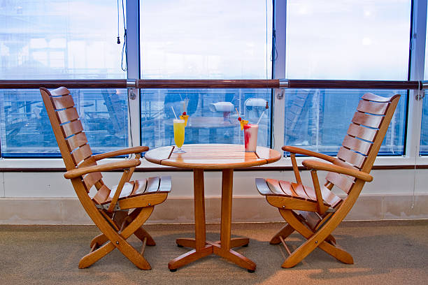 Modern empty seats and tables inside a ferry lounge