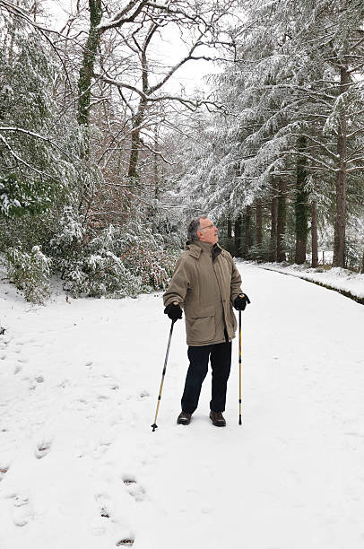 istock Senior man in snowy forest 182419794