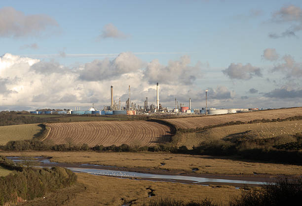 Panorama of oil refinery and coast Panorama of oil refinery and coast milford haven stock pictures, royalty-free photos & images