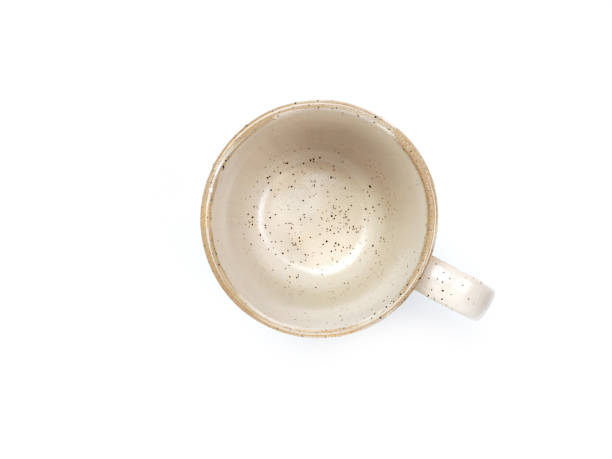 istock Empty beige mug with dotted and brown rim isolated on white background Used for home or restaurant, food design, kitchenware and tableware. 1824203134
