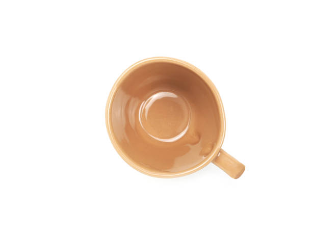 istock Empty brown mug isolated on white background. Concept kitchen utensils and tableware. Top view, flat lay. 1824203136