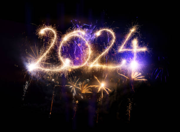 istock Sparkler Happy New Year 2024 with fireworks 1824205849