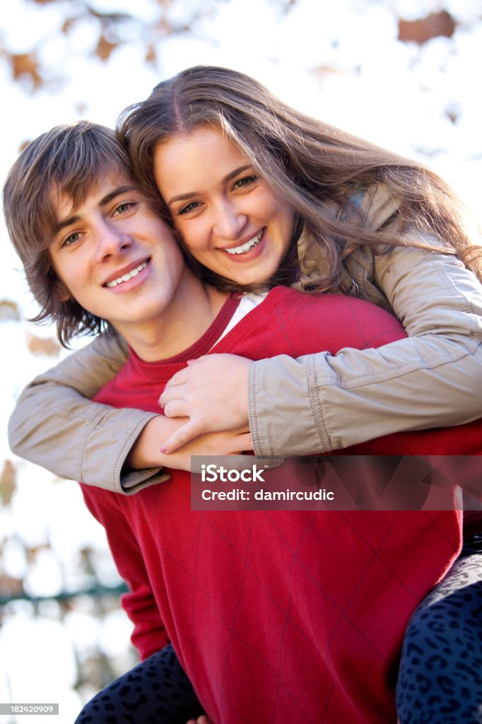 Happy young couple having fun outdoors Couple - Relationship Stock Photo