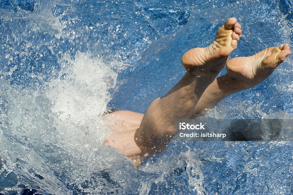 Swimming Pool Man diving into water Surfing Stock Photo
