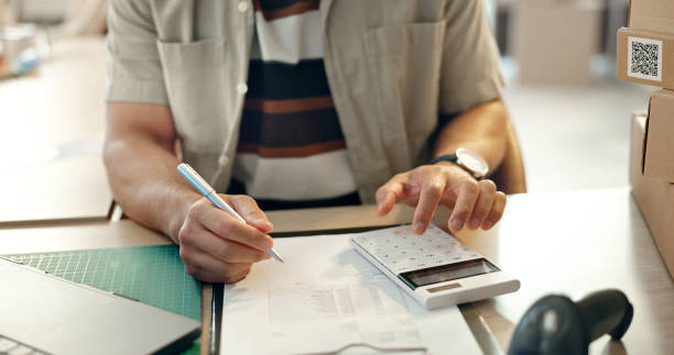 istock Closeup, ecommerce or man with paperwork, calculator or writing with planning, finance or economy. Person, hands or entrepreneur with documents, startup or income with accounting, savings or increase 1824212258