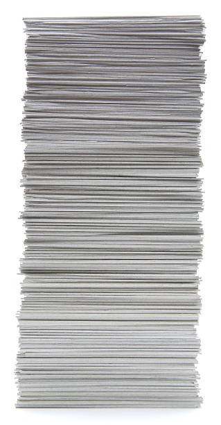 Large stack of hand trimmed cards on a white background stock photo