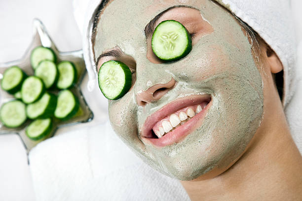 Beauty with cucumber slices on eyes Beauty with cucumber slices on eyes cucumber-face-pack stock pictures, royalty-free photos & images