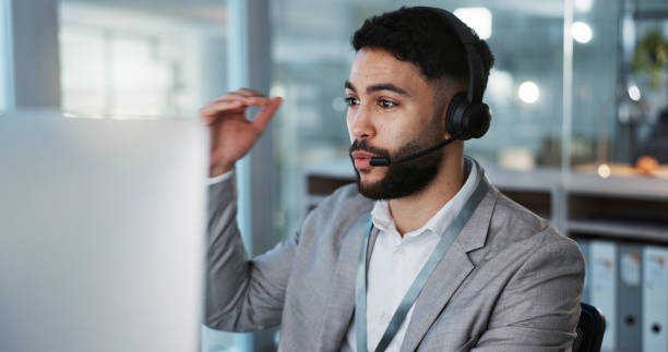 istock Computer, call center and man talking to customer service, crm support or contact us at help desk for inbound marketing. Communication, telemarketing and sales agent chat to client in lead generation 1824229874