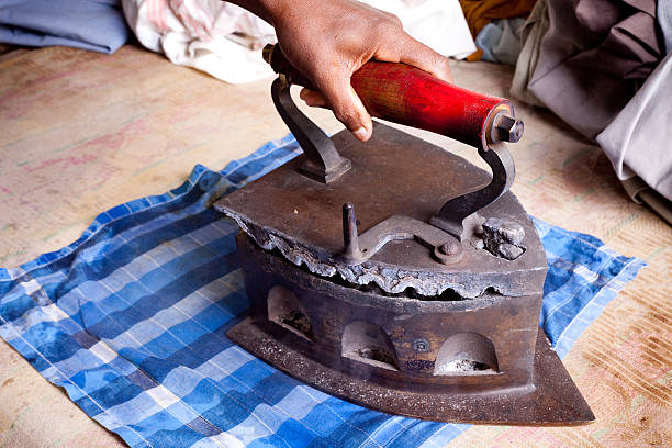 istock Traditional way of Ironing clothes in India 182423330