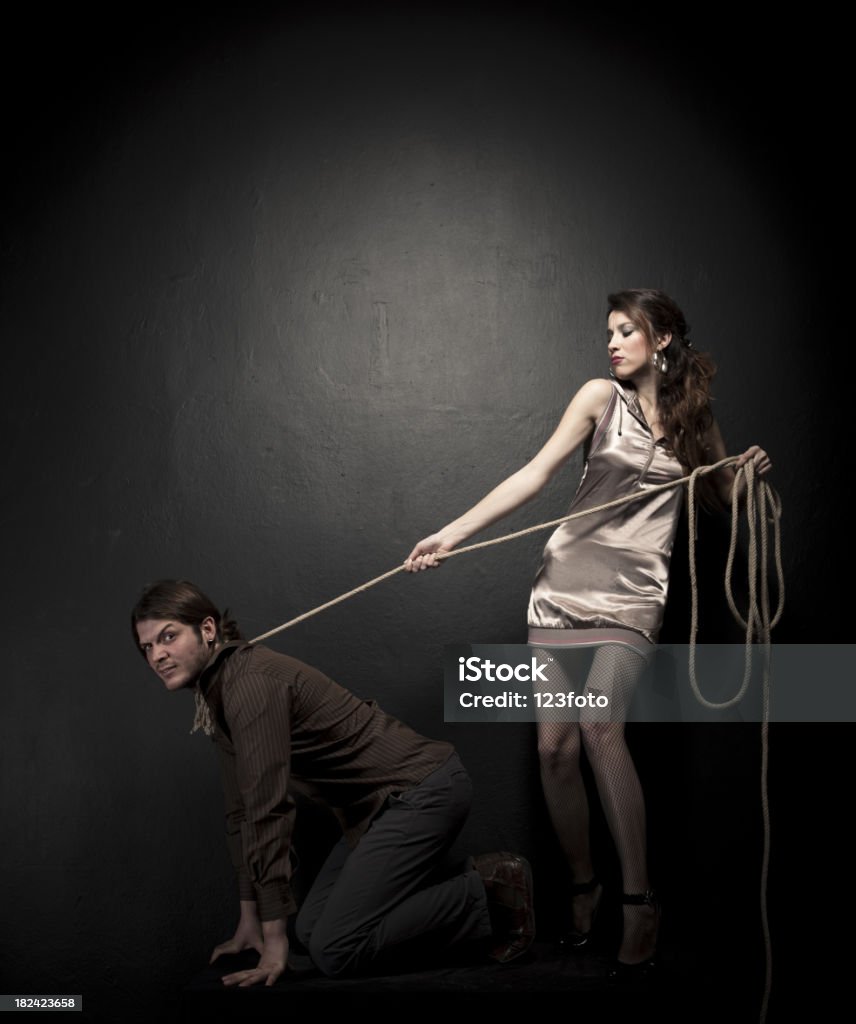 Loyalty Young couple on black background. Leading Stock Photo