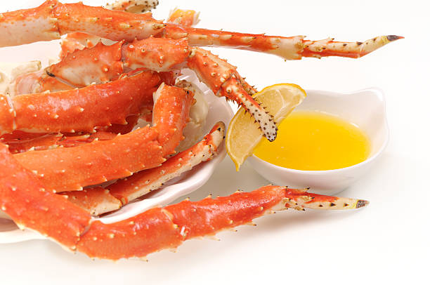 istock Cooked king crab legs and claws served with butter 182424098
