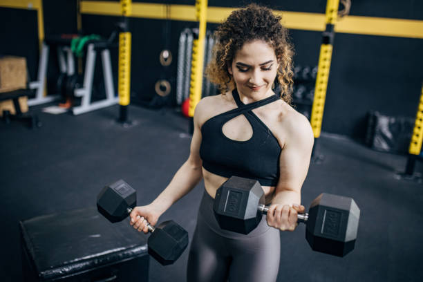 istock Woman training with dumbbells 1824246036