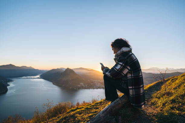 istock Young woman enjoys time on mountain top 1824249746