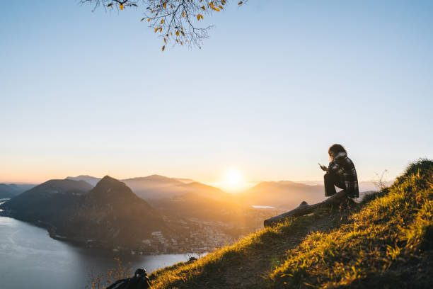 istock Young woman enjoys time on mountain top 1824249750