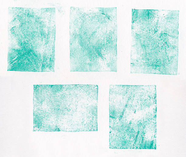 A collection of blue letterpress printed square shapes stock photo