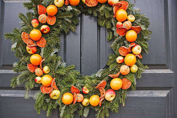 istock Natural Christmas wreath with apples and oranges 182425868