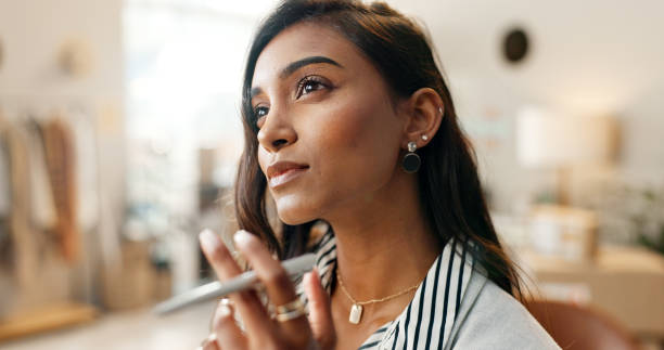 istock Face, thinking and a designer indian woman in her workshop for logistics or supply chain planning. Idea, retail or ecommerce with a young employee problem solving a delivery strategy for distribution 1824261563