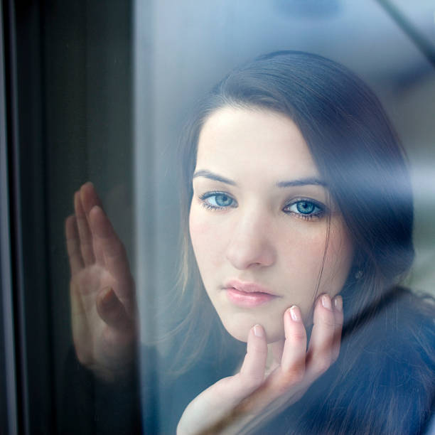 istock Attractive Young Woman Looking at Camera with Longing and Melancholy 182426768
