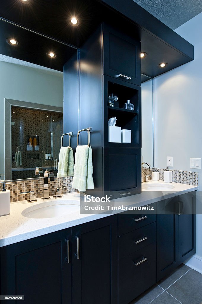 Luxury Bathroom Contemporary lavatory with double sink and glass tile backsplash. Bathroom Stock Photo