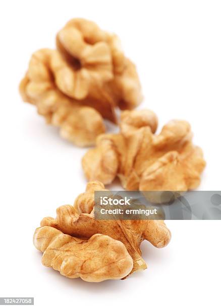 Walnuts Isolated On White Vertical Stock Photo - Download Image Now - Walnut, Appetizer, Brown