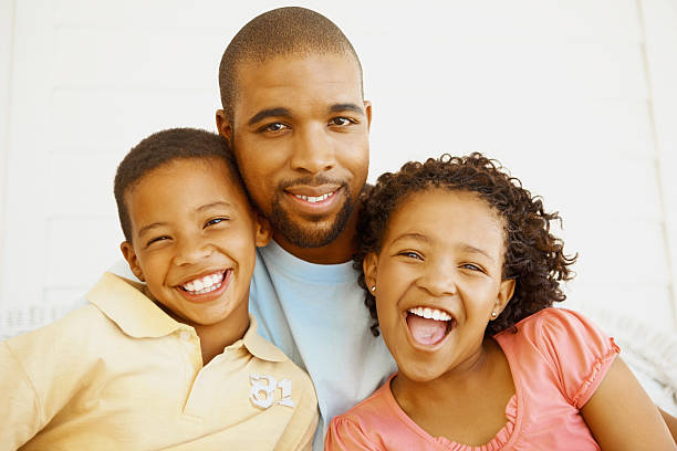 istock Father with son and daughter having fun 182427073