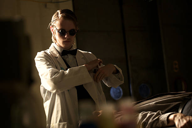 Terrifying creepy doctor and man on operating or examination table.