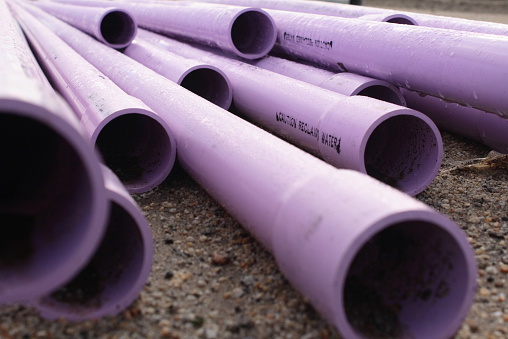 Close up of recycled or reclaimed water pipes used for irrigation.