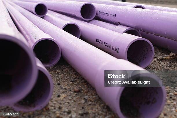 Purple Pipes With Caution Stamp Stock Photo - Download Image Now - Pipe - Tube, Recycling, Water