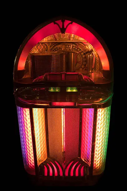 "This is the Wurlitzer 1100 Jukebox was produced from 1947 to 1949. It is a 24-selection jukebox that plays 78-RPM shellac records. Night shot with available light, 400 ISO, shallow depth of field."