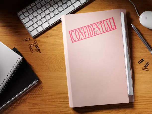 Photo of Confidential Folder on a Desk