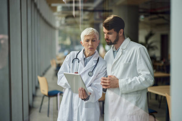 istock Medical experts working on touchpad in a hospital. 1824281119