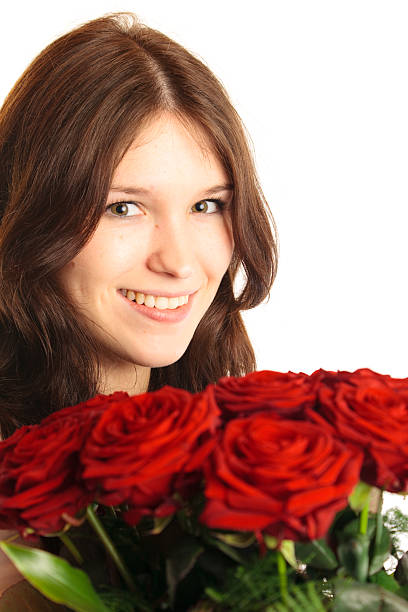 istock young woman with roses 182428288