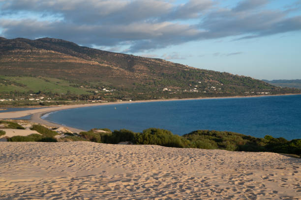 istock Sandy Beach with Clear Blue Water and Mountain View 1824290063