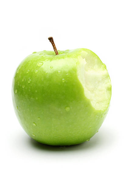 Bite on a Green Apple "Green apple eaten with a bite, isolated on white background.Similar images -" apple with bite out stock pictures, royalty-free photos & images