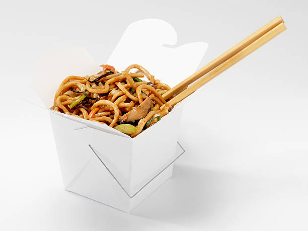 Chinese Shanghai Noodles with Chopsticks Chinese Shanghai Noodles with Chopsticks in Take Out Container -Photographed on Hasselblad H1-22mb Camera chinese takeout stock pictures, royalty-free photos & images