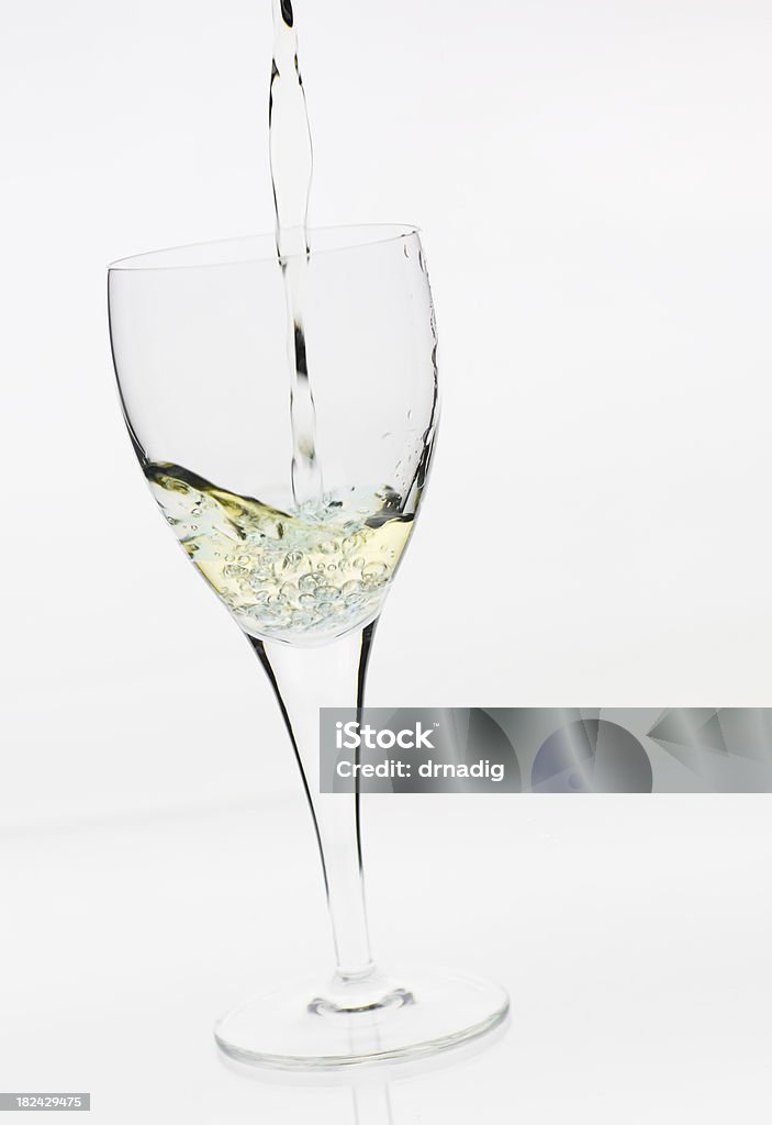 Pouring White Wine Pouring wine into a glass. Pouring Stock Photo