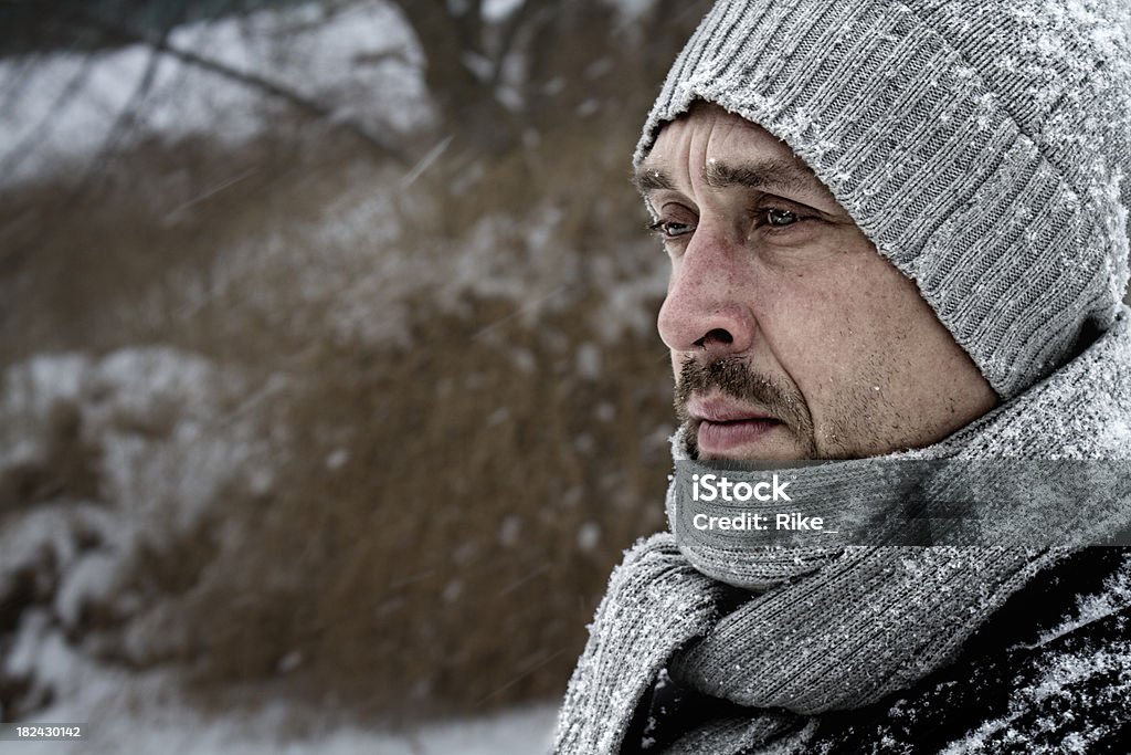 Thoughtful in snowy winter Close up of a thinking sad man / bleach bypass effect Human Face Stock Photo
