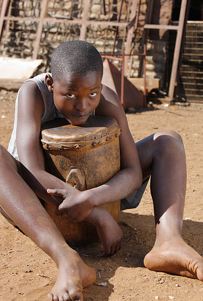istock African boy with a drum South Africa 182430393