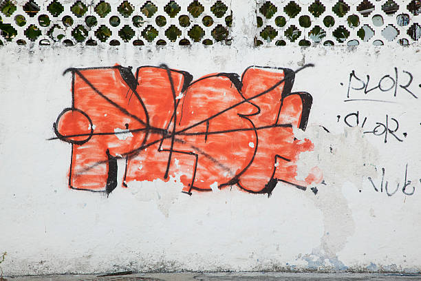 istock Bright Orange Grunge Grafitti on Stucco Wall 182431064
