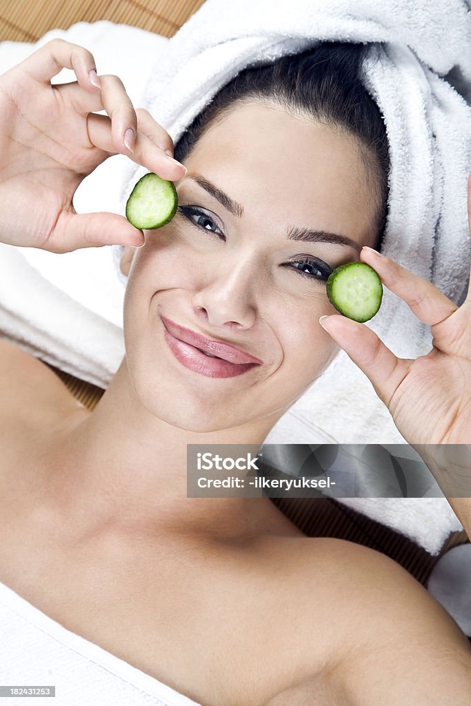 Beauty with cucumber slices on eyes Adult Stock Photo